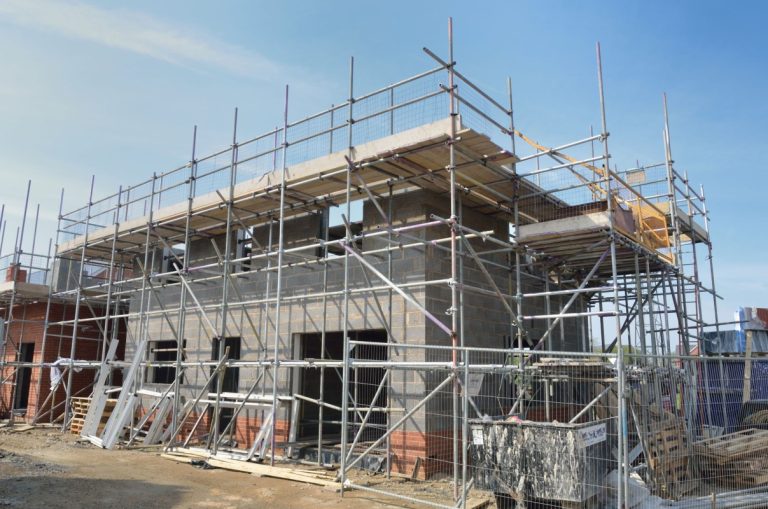 How retaining walls, drainage, and grading affect a home site